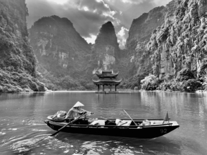 BW Lady Rowing the Boat in Vietnam