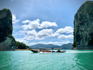 Boat Between Massive Rocks