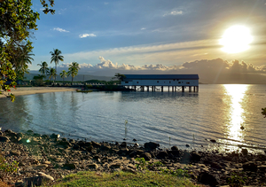Long House on the Water at Sunset