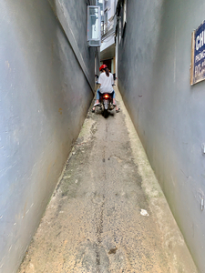 Motorbike Driving Up the Alley