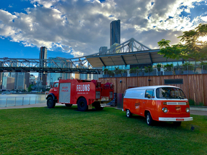 Red Trucks in Front of the Bridge