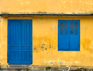 The Yellow House with Blue Windows and Door