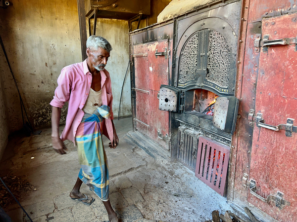 Man Fuelling Up the Fire Print