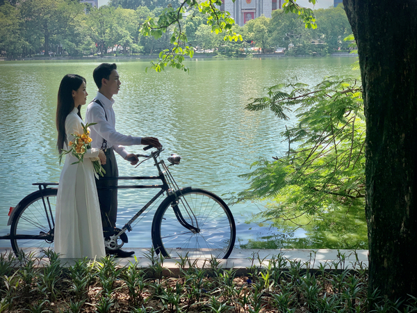 Newlyweds by the Lake with a Bicycle Print