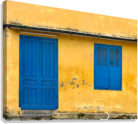 The Yellow House with Blue Windows and Door Canvas Print